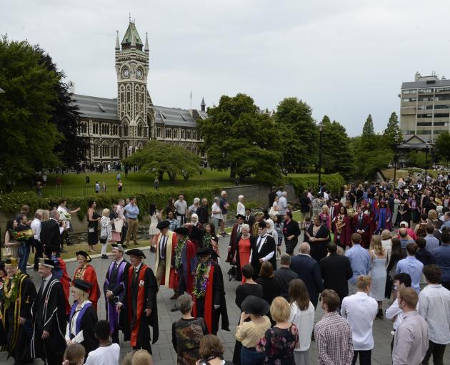 University of Otago graduands and staff march through the university grounds on Saturday. PHOTO:...