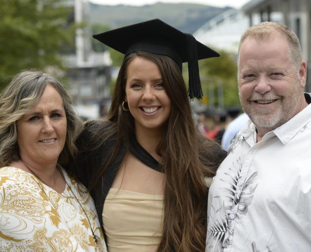 Karilyn Cribb and Andrew Williams, of Nelson, celebrate the graduation of their daughter Ferne...