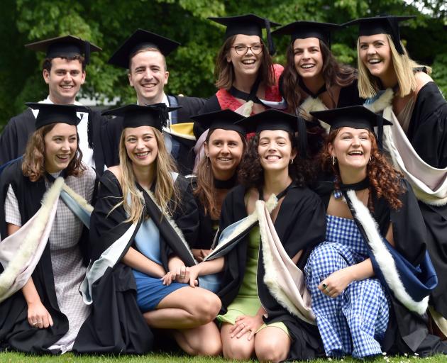 A group of friends still happy to have completed their degrees despite no capping ceremony are ...