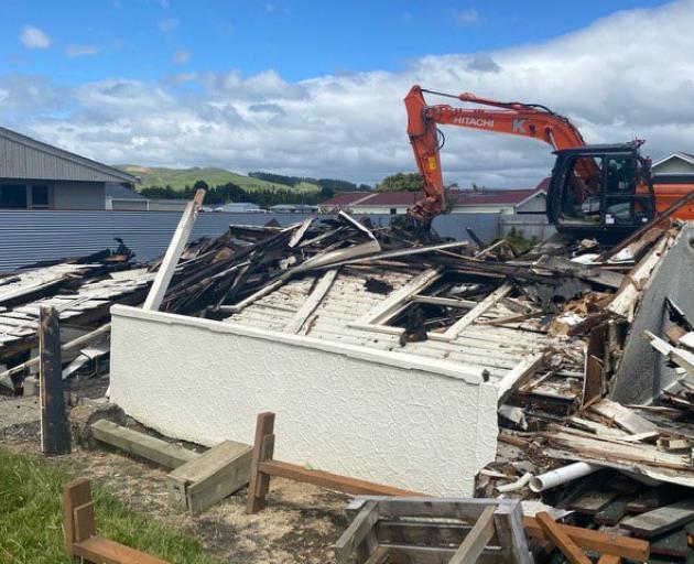 A house in Gore was demolished after being badly damaged by fire on Saturday. PHOTO: JAMES HALL