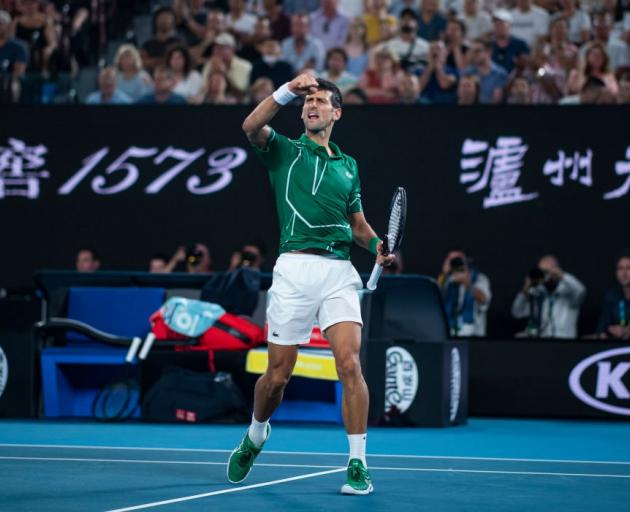 Novak Djokovic celebrates his semifinal win over Roger Federer at the Australian Open last night....