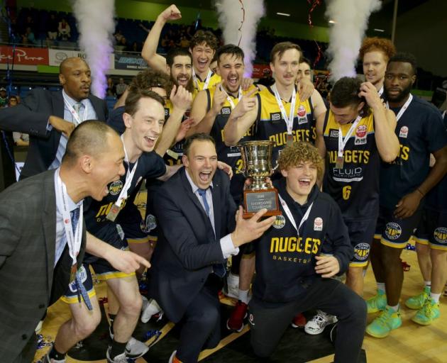 The Otago Nuggets celebrate after claiming their first NBL championship last night in Auckland....
