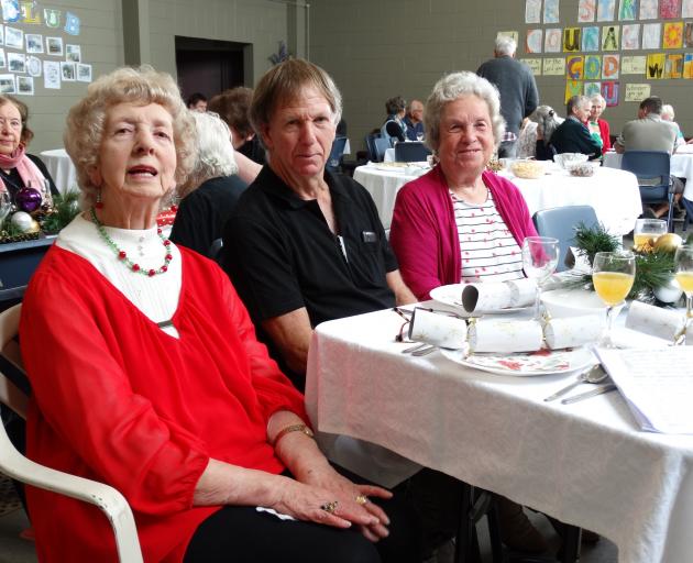 Community member (left) Shirley Cleaver awaits Christmas lunch with her son Wayne Cowie, and Joan...