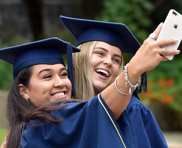 Libby Blore (22, left) and Sarah Thompson (21) celebrate collecting Otago Polytechnic bachelor of...