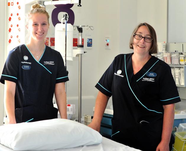 Senior cardiorespiratory physiotherapists Sammie Graham (left) and Ange Price work with intensive...