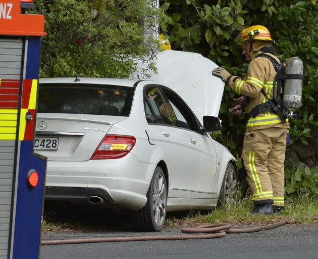 A late-model Mercedes Benz hit a street light pole at Opoho Loop Rd in Dunedin this morning. PHOTO: GERARD O'BRIEN 