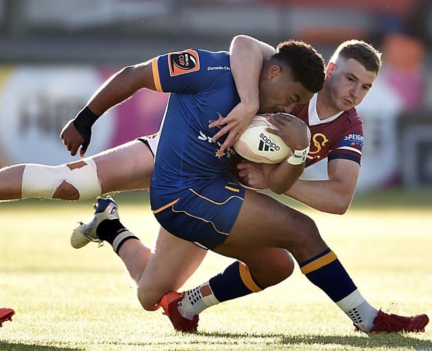 Otago winger Vilimoni Koroi is tackled by Southland’s Rory van Vugt during a Mitre 10 Cup clash...