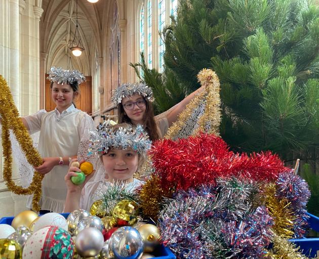 Christmas angels (from left) Theodora Clarke-Wallace (11), Charlotte Tallon-McCarthy (6), and...