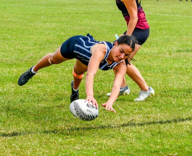 St Hilda's Collegiate School pupil Annie Timu dives for a try on day two of the New Zealand...