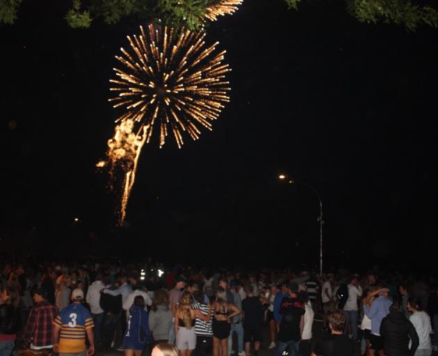 New Year's Eve party-goers in Wanaka watch a fireworks display at midnight. Photo: Tim Miller