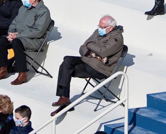 U.S. Senator Bernie Sanders sit socially distanced as he attends the Presidential Inauguration of Joe Biden. Photo: Reuters/pool