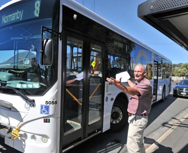 Dunedin Tramways Union delegate Alan Savell shows how a bus is unable to fit in a Macandrew Rd...