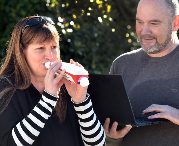 Jade Star Childcare and Learning Centre manager Amanda Dore tries a new Covid-19 breath analyser,...