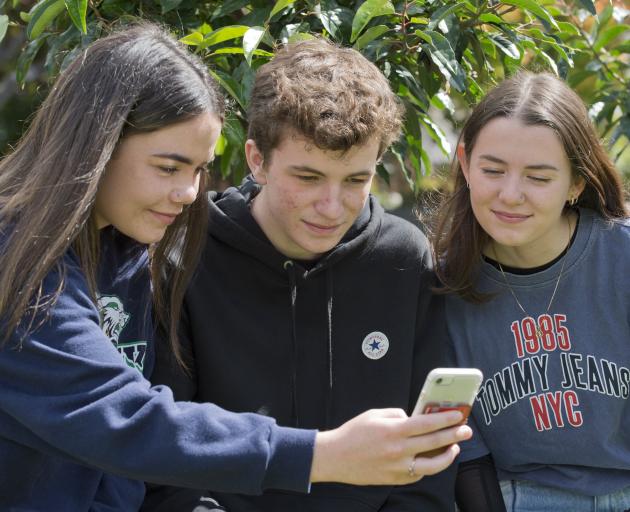 Former Kavanagh College year 13 pupils (from left) Emily Kerr-Bell (18), Sam Meikle (17) and...