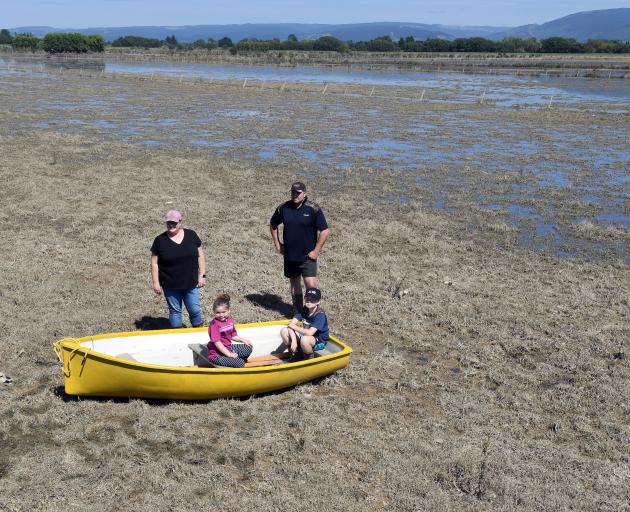 Dairy farm manager Dale Harris (right) and family members (from left) Jaclyn, Lexi (6) and Lane ...