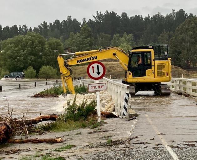 Patearoa township bridge was being cleared of debris this morning after flooding in the Maniototo...