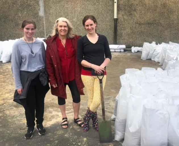 Sandbagging in South Dunedin during the flood alert are (from left) Larissa McStay, Ingrid Leary...