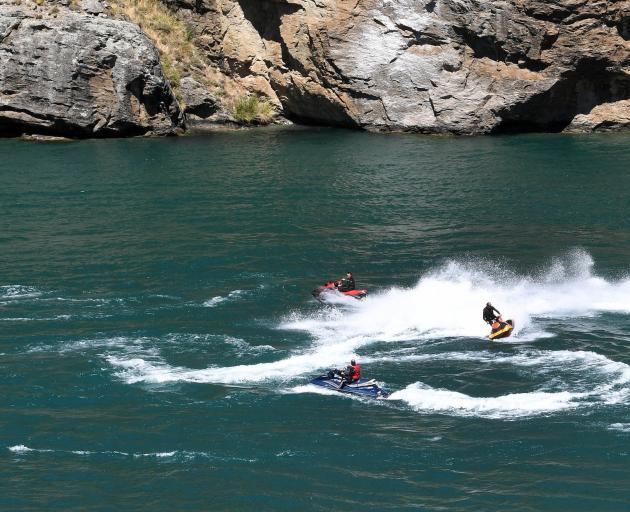 Jet-skiers play on Lake Dunstan recently. PHOTO: STEPHEN JAQUIERY