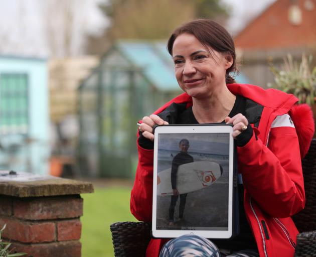 Sally Flavill shows a photograph of her nephew Joseph Flavill, who has awoken from a coma with no knowledge of the coronavirus disease (COVID-19) pandemic after he was injured in a car accident in March 2020. Photo: Reuters Sally Flavill shows a photograph of her nephew Joseph Flavill, who has awoken from a coma with no knowledge of the coronavirus disease (COVID-19) pandemic after he was injured in a car accident in March 2020. Photo: Reuters