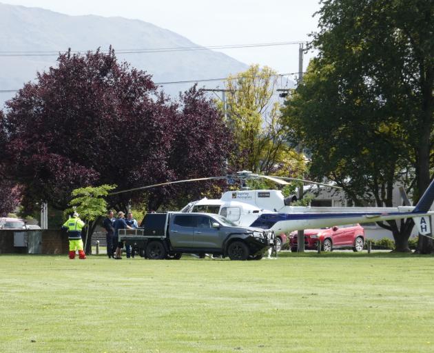 An Aspiring Helicopters helicopter and search and rescue personnel involved in the search for the...