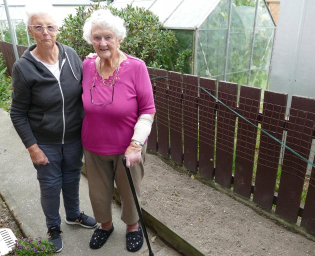 Balclutha neighbours Ila Ryan (left), and Val McNamara stand next to a garden border where Mrs...