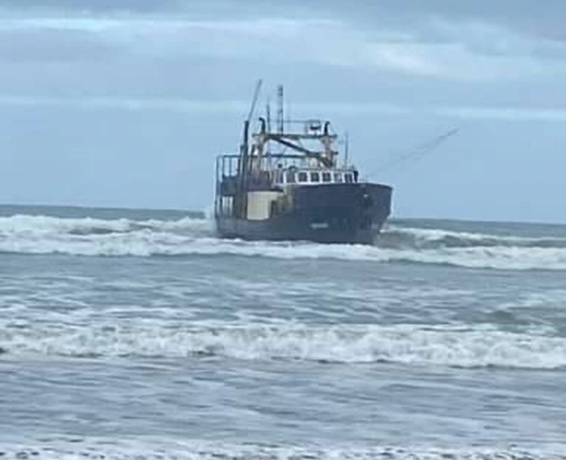 The boat has beached on Big Bay. Photo: Supplied via NZH