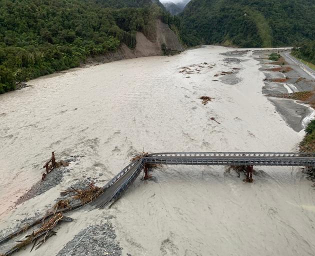 Washed out ... The State Highway 6 bridge over the Waiho River is ripped apart after an ‘...