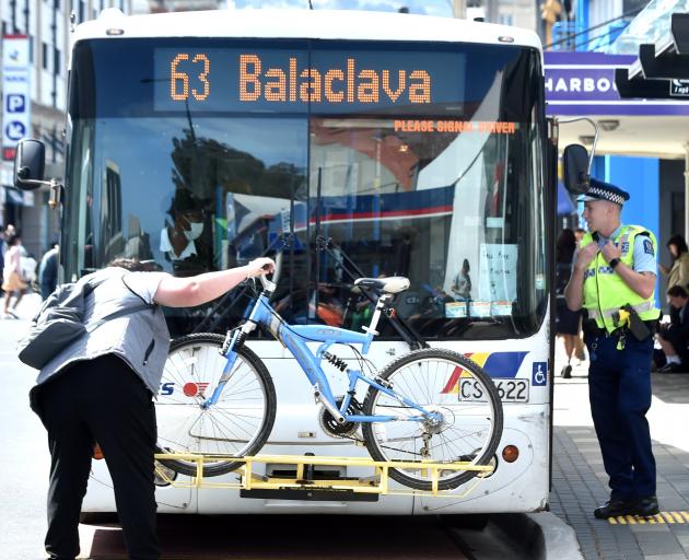 Police talk to a Bus driver at the Dunedin bus hub on Thursday. PHOTO: PETER MCINTOSH
