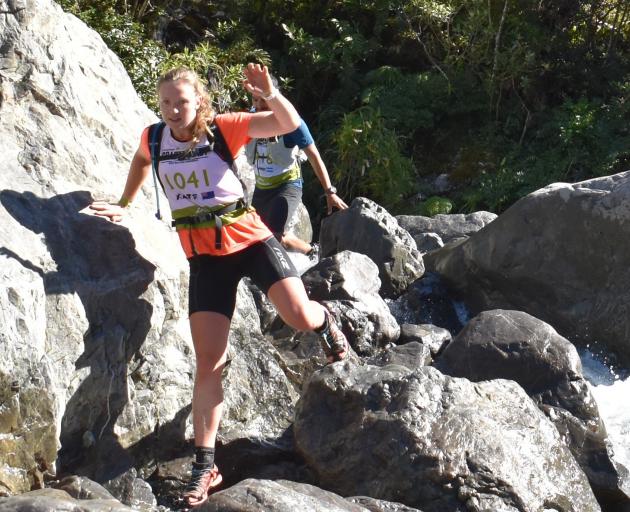 Dunedin's Kate Downie-Melrose negotiates a way through Doreen Creek during the mountain
...