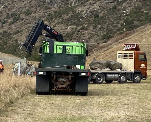 Contractors removing three rocks from Barnett Park. Photo: Amanda Rudkin