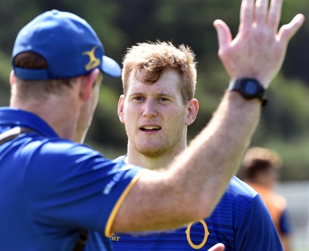 Otago lock Jack Regan listens to coach Tom Donnelly explain a lineout move at training at Logan...