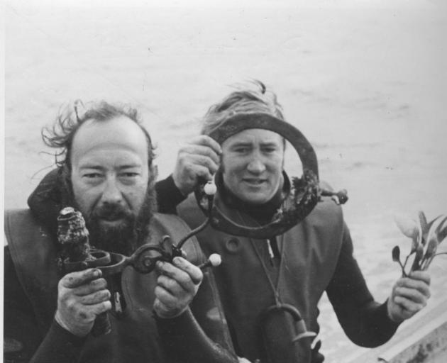 Kelly Tarlton (left) and John Dearling display items found while diving on the 
...
