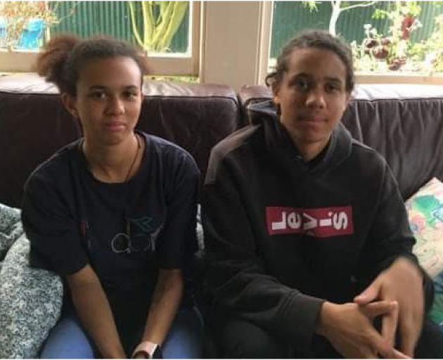 Lewis O'Malley-Scott with cornrows sitting beside his sister Ori. Photo: Supplied via RNZ