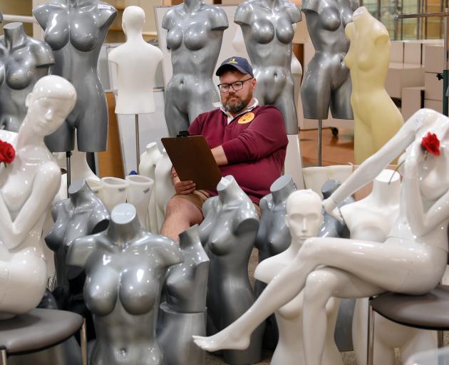 Proctor Auctions manager Ronnie Proctor prepares for an auction of H&J Smith department store...