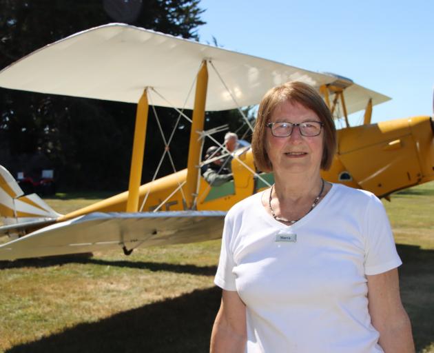 Mandeville Fly-In organiser Maeva Smith enjoys the sun at the Mandeville airfield during the...