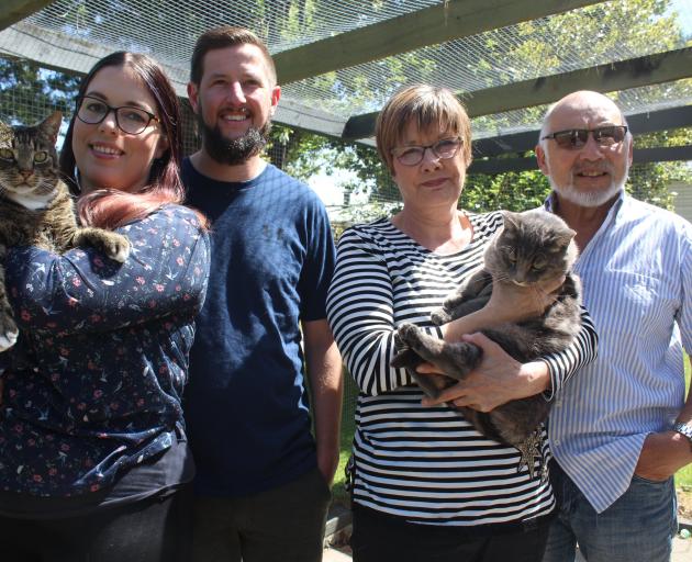 The soon-to-be owners of Invercargill's Panda Cattery Courtney (left, holding Colin), and
...