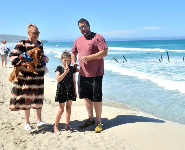 Enjoying a day at St Clair Beach are Jemma and Andrew Wills, of Dunedin, with their daughter...