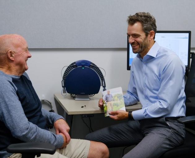 Audiology South director Anthony Rowcroft (right) talks to Dick Tayler about his hearing. PHOTO:...