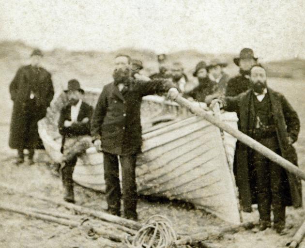 Chief Officer Lindsay and local helpers gathered around the damaged 
...