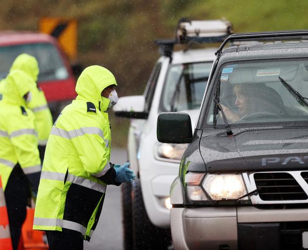 Police check reasons for travel to and from Auckland at a checkpoint north of Auckland recently....