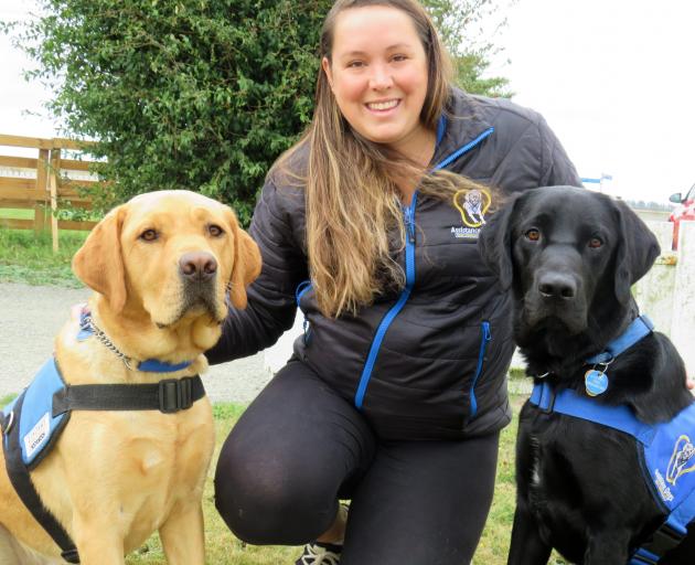 Assistance Dogs New Zealand Trust dog training co-ordinator Ashleigh Murray with Jack (left) and...