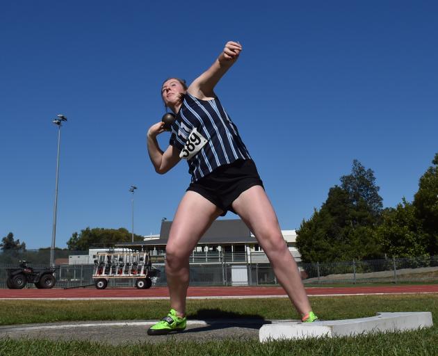 Renee Willis, of St Hilda’s Collegiate, shows her record-breaking style in the shot put.