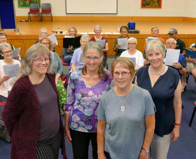 The Phoenix Singers' new interim conductor Claire Stevens (third from left), and three new...