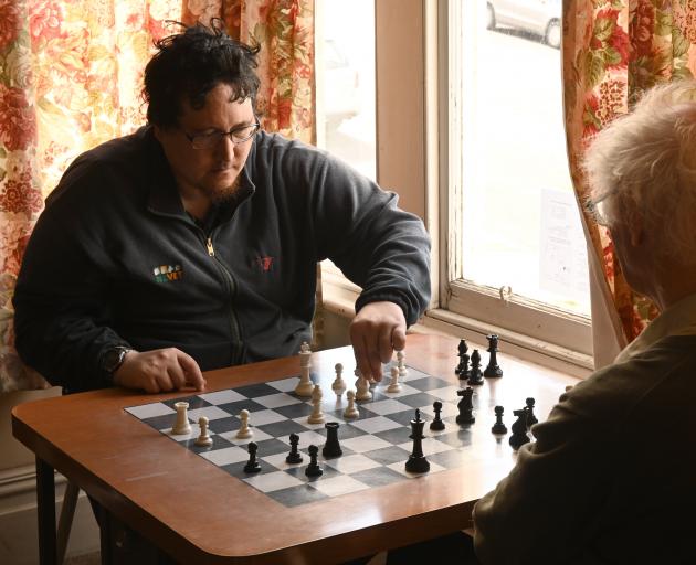 Hildon Nisa, of Dunedin, and David Reid, of Herbert (below) play a game of chess at the Otago...