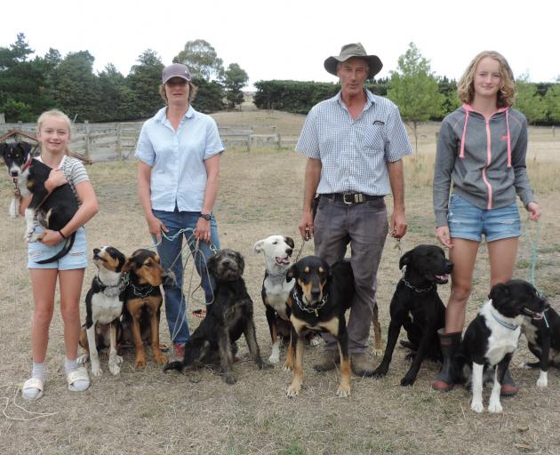 Ramona and Jim Sidey with their daughters Millie (left) and Hannah, and their team of dogs at...