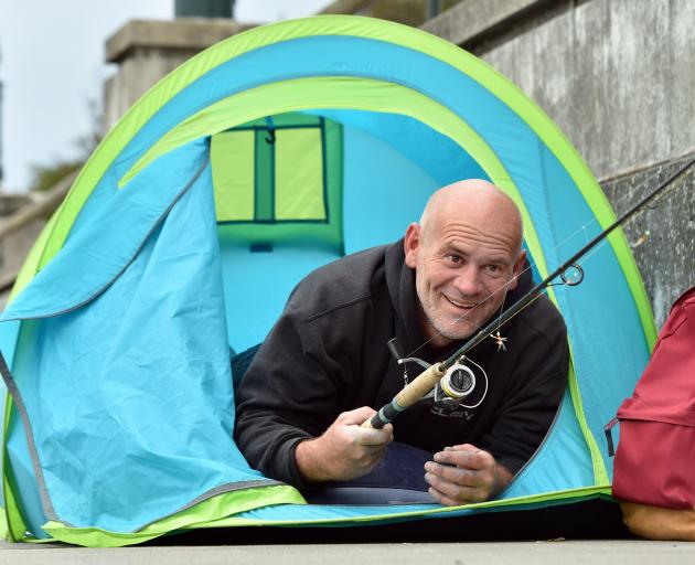 Fisherman Daniel Scorringe, of Dunedin, pitched his tent beside Otago Harbour yesterday morning...