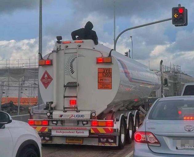 A man was spotted riding on top of a fuel tanker on the Te Puke Highway. Photo: Andrew Mckean A man was spotted riding on top of a fuel tanker on the Te Puke Highway. Photo: Andrew Mckean