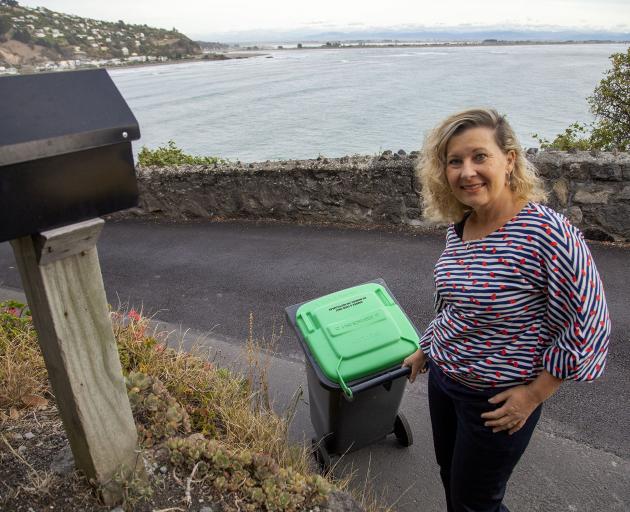 Liza Sparrow puts out a green bin. Photo: Geoff Sloan