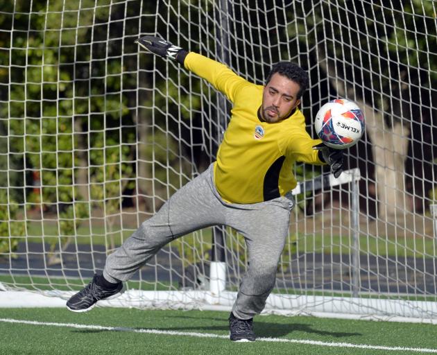 Al-Huda goal keeper Hassan Al-Saayed warms up for the Race Relations Week Tournament of the...