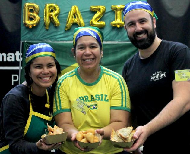 Brazilians (from left) Nathalia Paiva, Elisangela Oliveira Pont and Thiago Sa cooked some snacks...